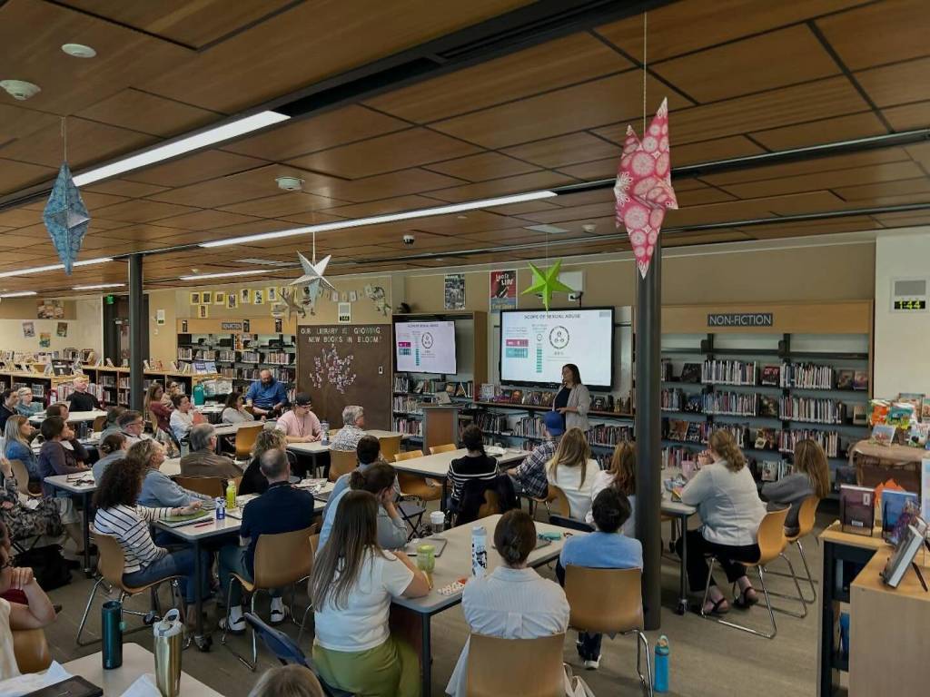 Photo courtesy of the Mercer Island School District
A member of Praesidium, a nationwide abuse-prevention and intervention firm, makes a presentation to Mercer Island middle school and elementary staff on April 29.