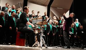 Artistic Director Paul Caldwell leads the Seattle Mens Chorus through its performance on May 5 at the Mercer Island High School Performing Arts Center. Andy Nystrom/ staff photo