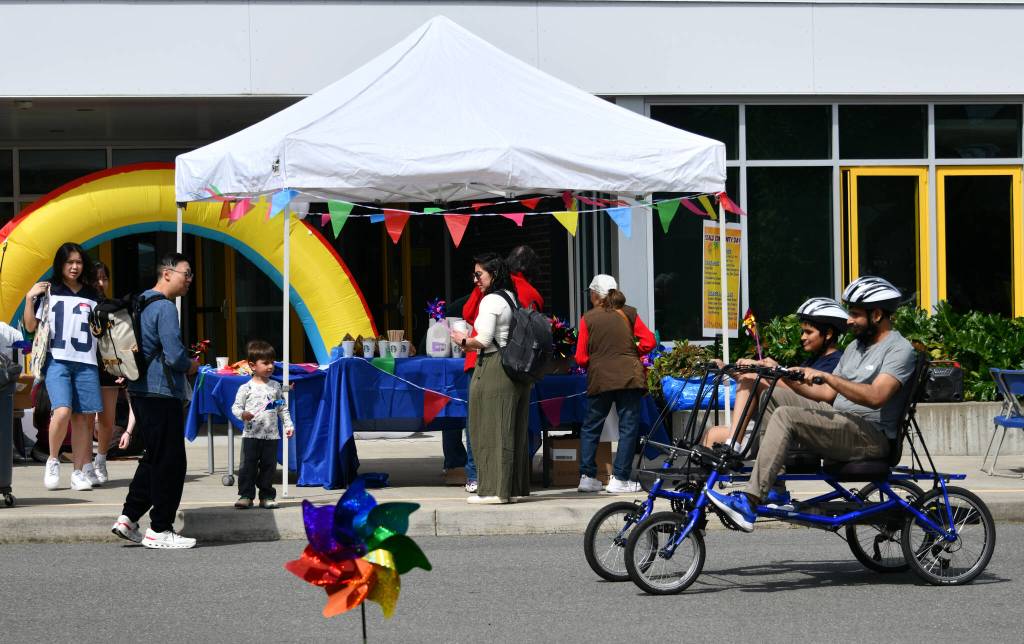 Attendees ride adaptive bikes at the Community Day of Inclusion. Andy Nystrom/ staff photo