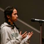 Mercer Island High School senior Inaya Chandrakant asks a question about the $13.4 million tort claim filed against the school district. Andy Nystrom/ staff photo