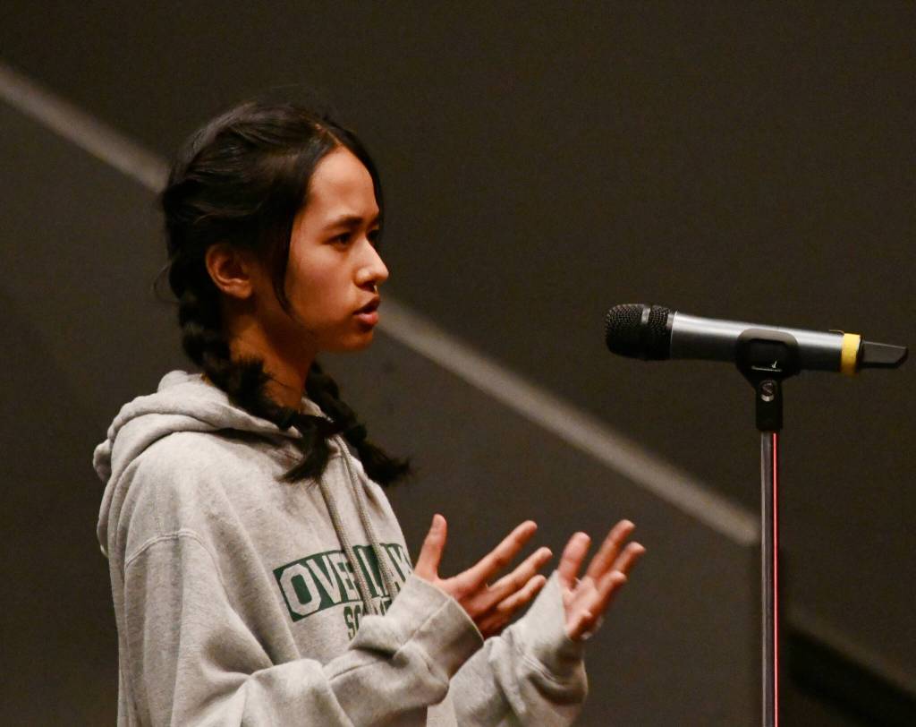 Mercer Island High School senior Inaya Chandrakant asks a question about the $13.4 million tort claim filed against the school district. Andy Nystrom/ staff photo