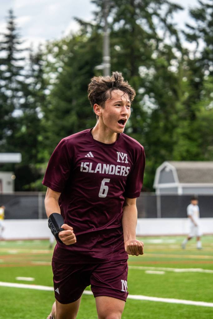 Mercer Island High Schools Bridge Gerry celebrates scoring one of his two goals in the 3A KingCo tournament championship match against Inglemoor on May 12. The Islanders won, 5-2. Photo courtesy of Ari Stoffer