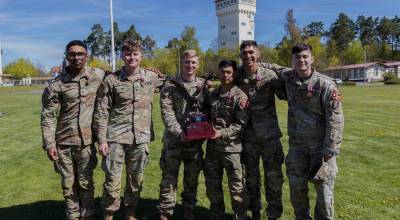First Lt. Benjamin Flaherty of Mercer Island (third from left), stands with Staff Sgt. Jonah Mang, Sgt. Marcus Robinson, Spc. Pedro Cardona, Spc. Matthew Falone and Pfc. Cleopheus Lane of the 7th Engineer Brigade after being named the winning squad of the 2026 Best Squad Competition hosted by the 21st Theater Sustainment Command at the Grafenwöhr Training Area, Germany, on April 24. Photo courtesy of United States Army Staff Sgt. Daniel Yeadon