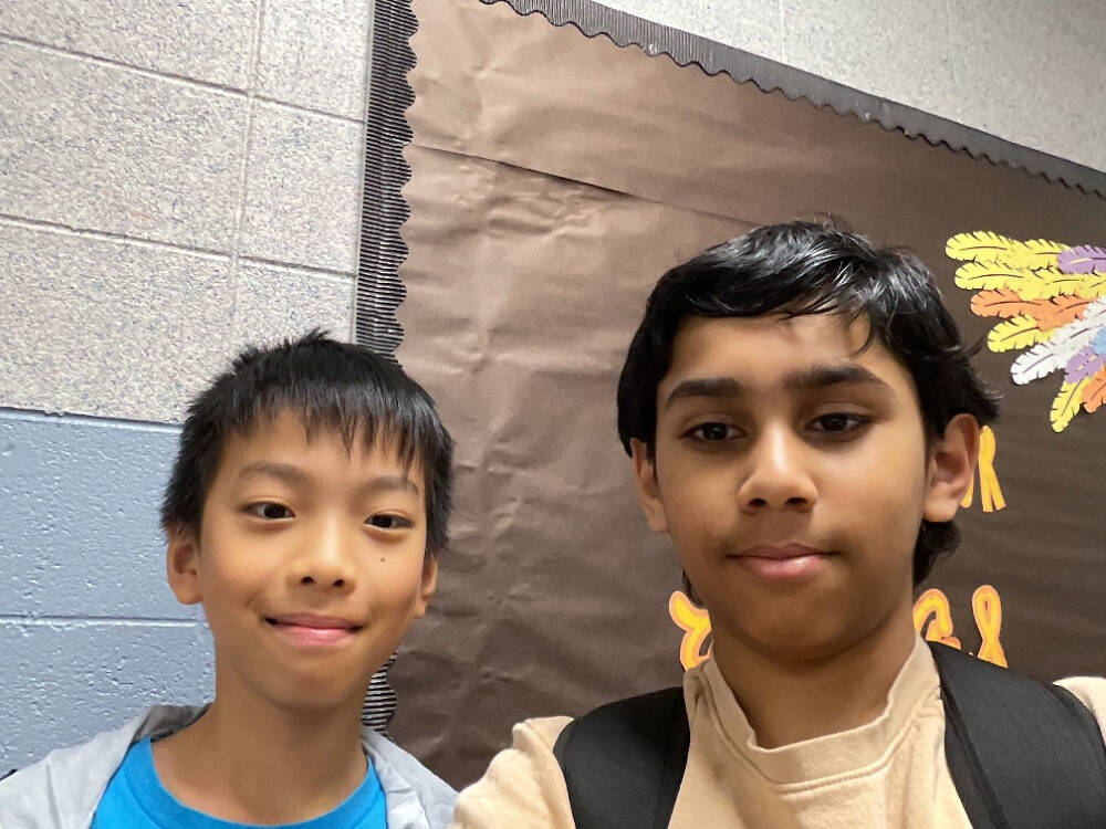 From left to right are Islander Middle School sixth-graders Irving Sun and Ish Singh, who are part of a 3D printing business with classmate Aadi Luhadia (not pictured). Courtesy photo