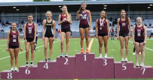 Mercer Island High Schools girls runners took seven of the top eight spots in the 3,200 run at the 3A KingCo championships. They are, from left to right: Tess Ahrenholz, Anna Ahrenholz, Bella Heczey, Sophia Rodriguez (first place), Ella Zhang, Dora Cheng and Elsa Bergman. Also pictured is Inglemoors Lola Estrada. Photo courtesy of Scott Knoblich