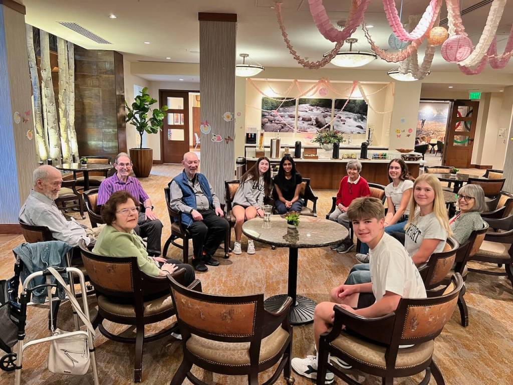 Mercer Island High School Student Tech Support club members visit with Aegis Living residents on May 18. Photo courtesy of Colleen Barneson