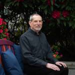 Photo by Moe K. Clark/InvestigateWest 
Joel Levin, the co-founder and director of programs for the Seattle-based nonprofit Stop Sexual Assault in Schools, poses for a portrait outside his home on May 17, 2026. Levin co-founded his nonprofit in 2015 after a family member was sexually assaulted by a peer on a school field trip.