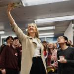 Mary Wayte, 1984 Olympic gold medalist swimmer, takes a selfie with the crowd at the Mary Wayte Pool Renovation Celebration on Jan. 30. Andy Nystrom/ staff photo