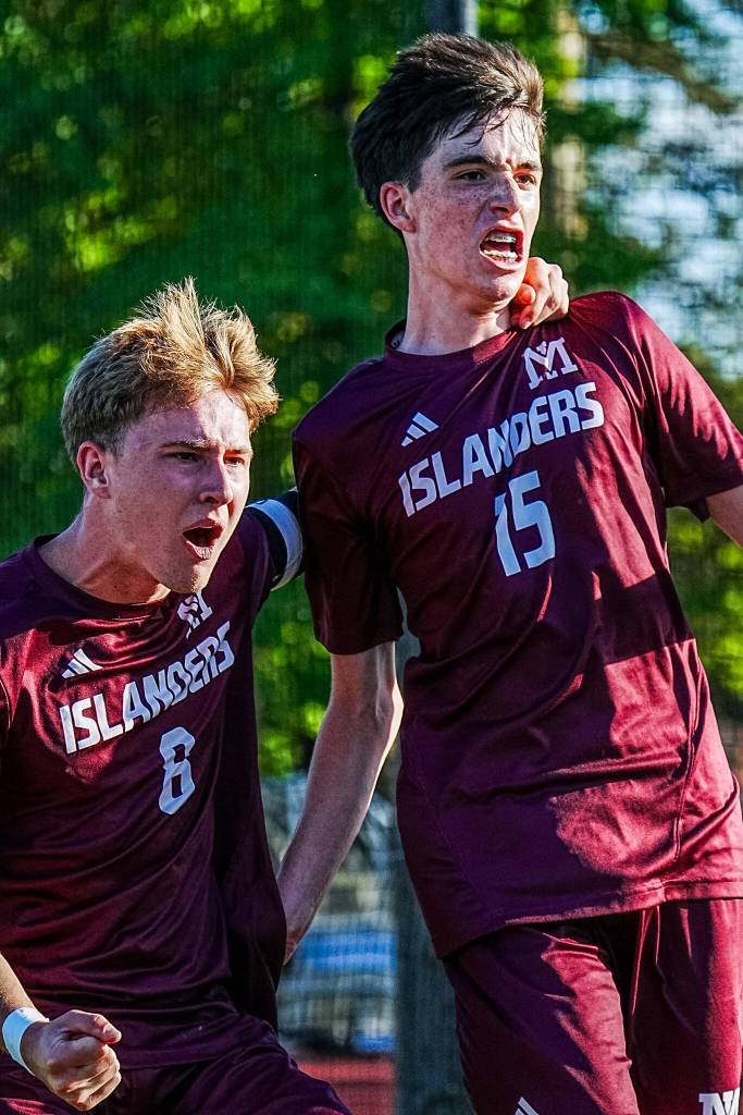 Mercer Island High School sophomore Dylan Jones, right, celebrates scoring his goal with junior Noah Zenden. Photo courtesy of Ari Stoffer
