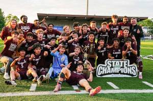 Mercer Island High Schools boys soccer team celebrates winning its second straight 3A state title. Photo courtesy of Ari Stoffer