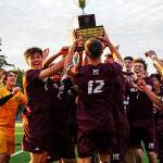 Mercer Island High Schools boys soccer players lift the state championship trophy. Photo courtesy of Ari Stoffer