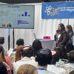 Northwest Yeshiva High School AlephLearn team members Natalie Aronov, Jessica Berezansky and Izzebella Dillman present their project to the crowd at the recent Center for Initiatives in Jewish Education (CIJE) Innovation Summit in East Rutherford, New Jersey. Courtesy photo