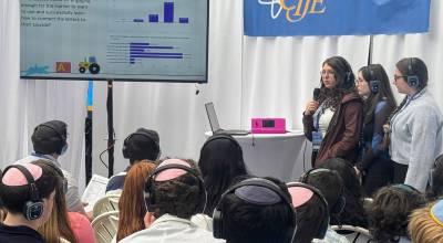Northwest Yeshiva High School AlephLearn team members Natalie Aronov, Jessica Berezansky and Izzabella Dillman present their project to the crowd at the recent Center for Initiatives in Jewish Education (CIJE) Innovation Summit in East Rutherford, New Jersey. Courtesy photo