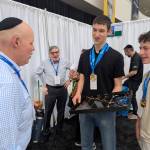 Northwest Yeshiva High School Grid64 team members David Liansky and Jonah Negrin show off the circuitry of their chessboard to the judges. Courtesy photo