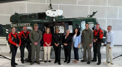 U.S. Congresswoman Kim Schrier and King County Sheriff Patti Cole-Tindall celebrate with King County Councilmembers and the rescue team in front of one of the countys two rescue helicopters equipped with hoist technology. Photo provided by the office of Kim Schrier