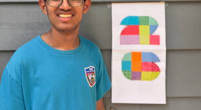 Mercer Islands Sameer Arora stands with his 2026 FIFA World Cup logo origami creation. Courtesy photo