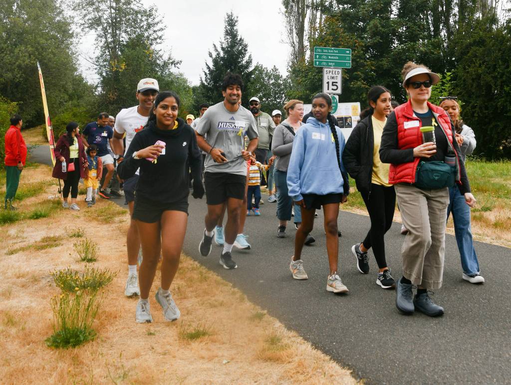 People start walking the trail at the Walk for Hope event. Andy Nystrom/ staff photo