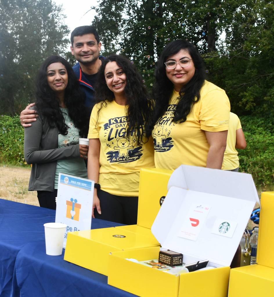 Friends gather for a photo at a break station along the Walk for Hope route. Andy Nystrom/ staff photo