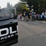 Neighbors gather for a National Night Out party on Aug. 4 in the 2200 block of 70th Avenue Southeast. Andy Nystrom/ staff photo